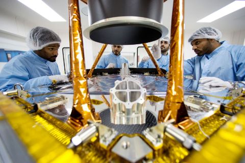 Emirati scientists work on a the Al Amal probe in a lab at the Mohammed Bin Rashid Space Center on the outskirts of Dubai.