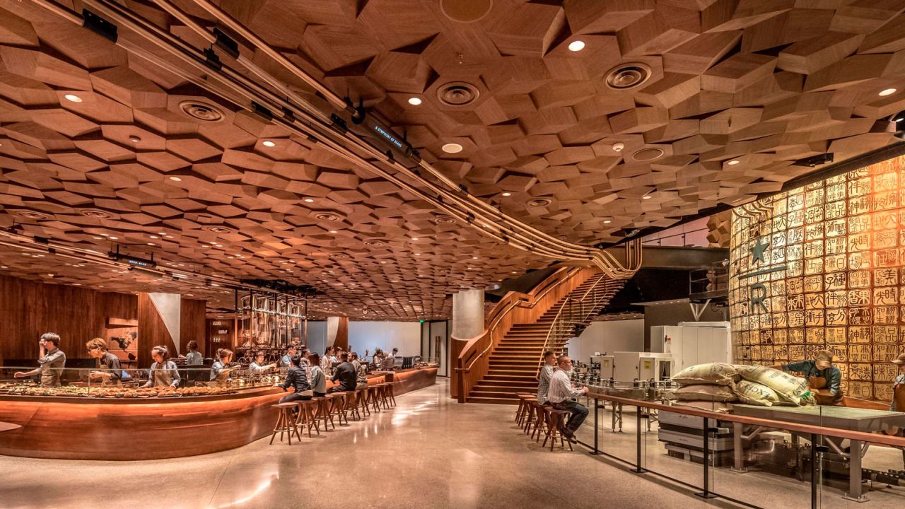 Starbucks Reserve Roastery in Shanghai features a two-story copper cask and three handcrafted wooden bars.