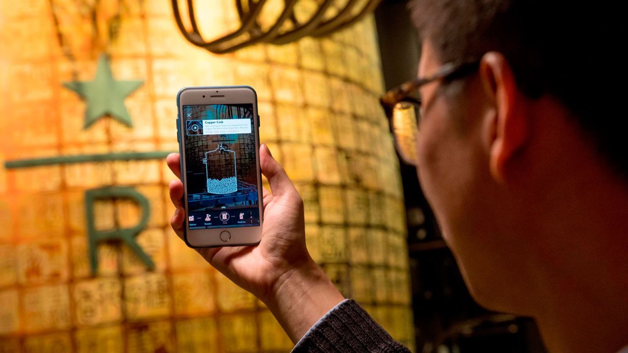 The Roastery app allows customers to unlock virtual badges by pointing their phones at different features.