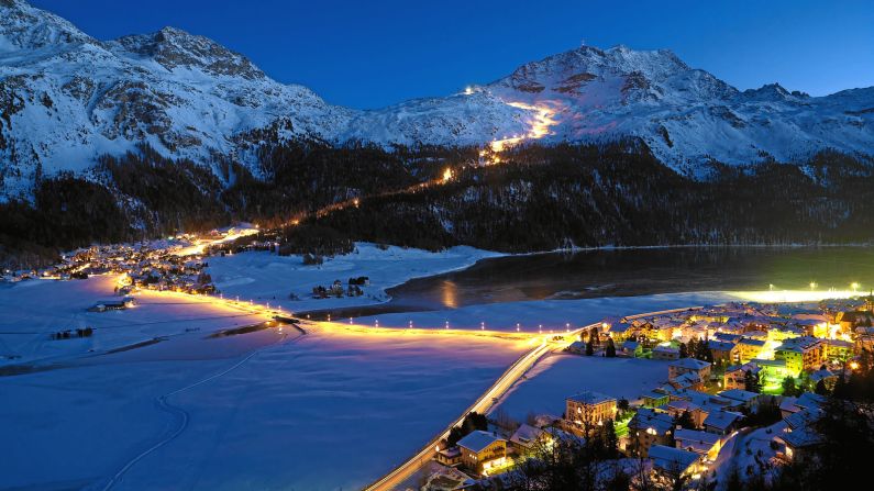 <strong>Light show:</strong> A ski slope is lit up on the Corvastch sector above the village of Silvaplana.