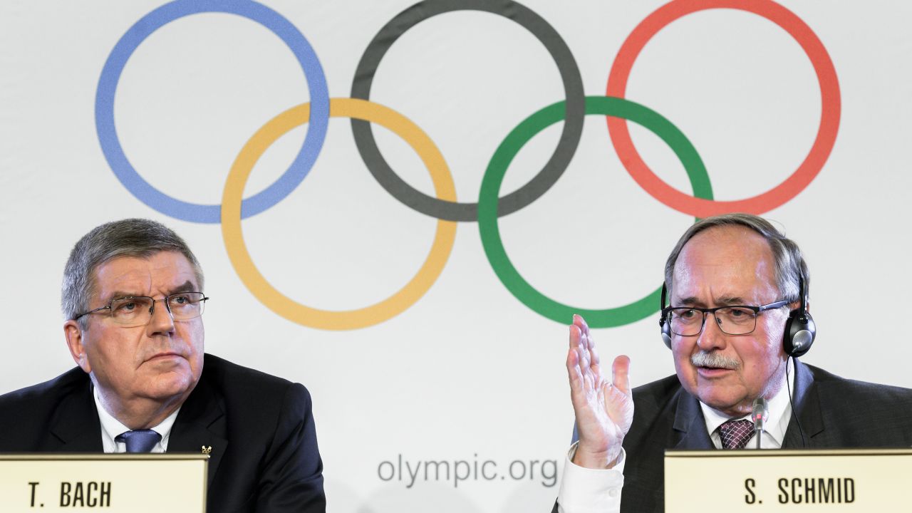 IOC President Thomas Bach (L) and Chairman of the IOC Inquiry Commission Samuel Schmid.