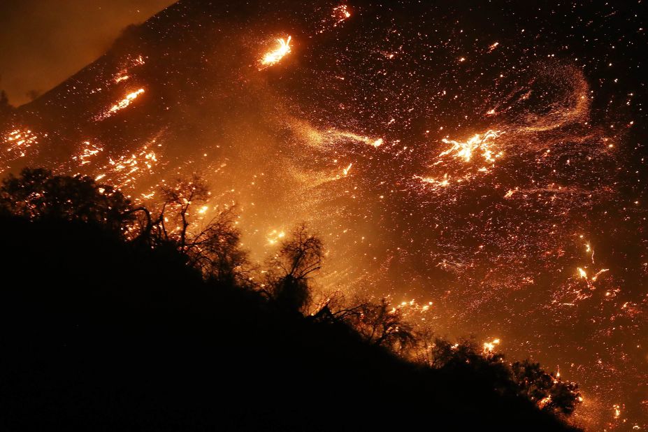 The Creek Fire burns on a hillside in the Shadow Hills neighborhood of Los Angeles on December 5.