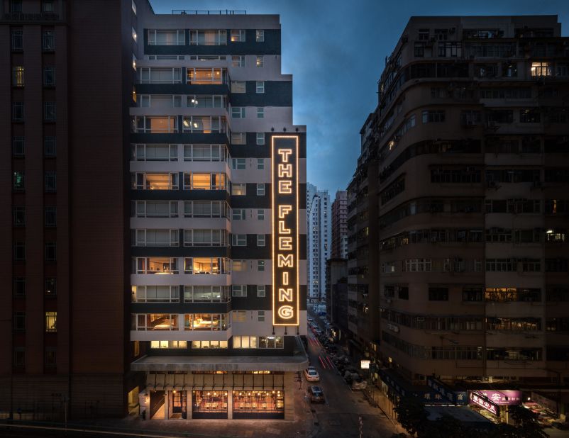 <strong>Bamboo business:</strong> On the hotel's facade, there's retro-inspired neon signage as well as a triangular-shaped wraparound light fixture that resembles bamboo scaffolding -- a fixture in Hong Kong construction.