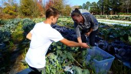Mason, now 15, and Nicole Tyson harvest food on their farm in Sharpsburg, Georgia. 