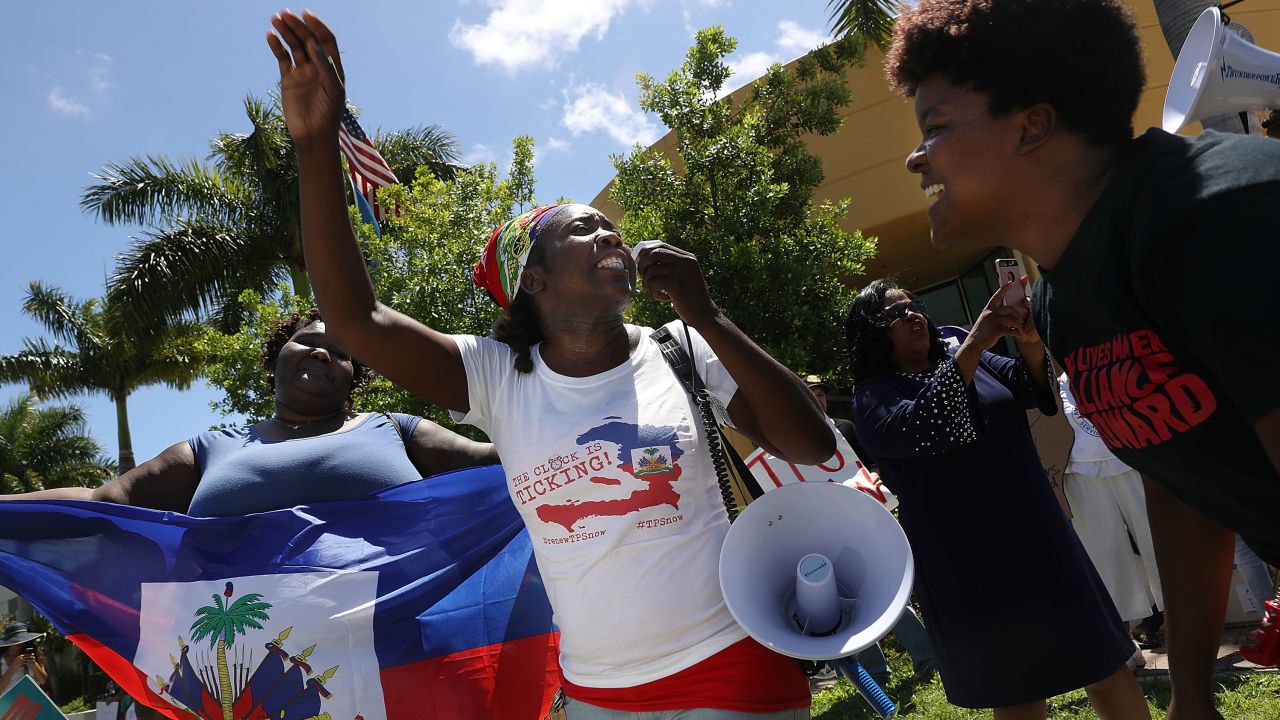 Earlier this year, Haitians marched to keep their protected status at an immigration office in Broward County, Florida.