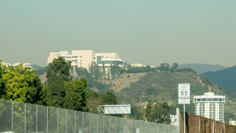 Smoke begins to cloud around the Getty Center as the Skirball Fire burns Wednesday.