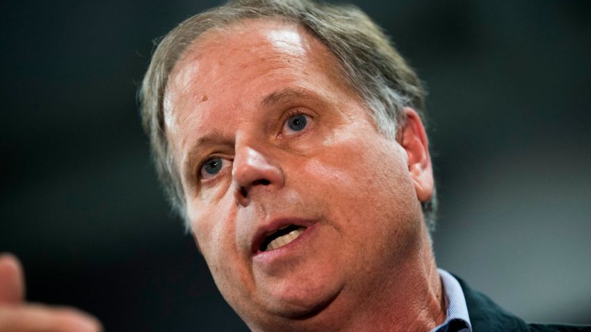 Democratic candidate for U.S. Senate Doug Jones takes questions from reporters at a fish fry campaign event at Ensley Park, November 18, 2017 in Birmingham, Alabama. Jones has moved ahead in the polls of his Republican opponent Roy Moore, whose campaign has been rocked by multiple allegations of sexual misconduct. (Photo by Drew Angerer/Getty Images)