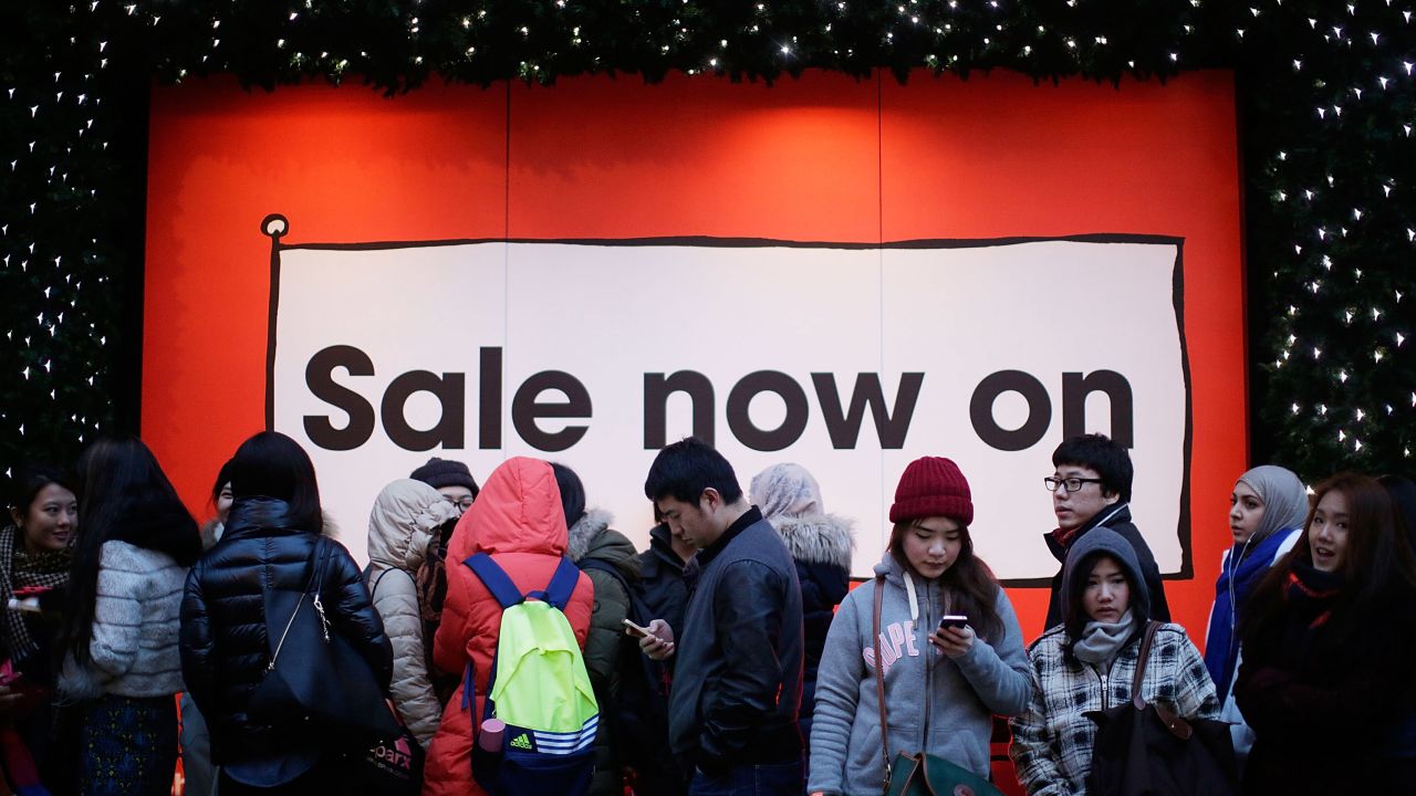 People in London wait in line in anticipation of the Boxing Day sales at Selfridges.