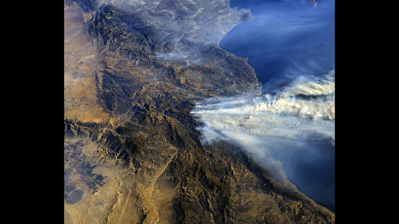 Smoke rises across Southern California in this image taken from the International Space Station on December 6.