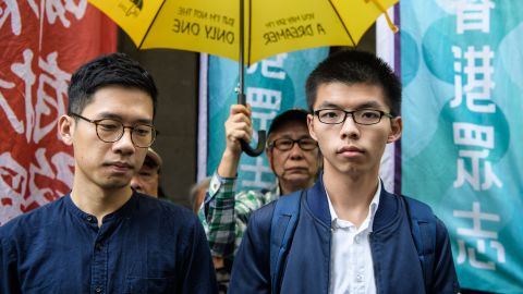 Joshua Wong (R) and Nathan Law arrive at the Court of Final Appeal for the first hearing in their bid to appeal their jail sentences in Hong Kong on November 7, 2017.