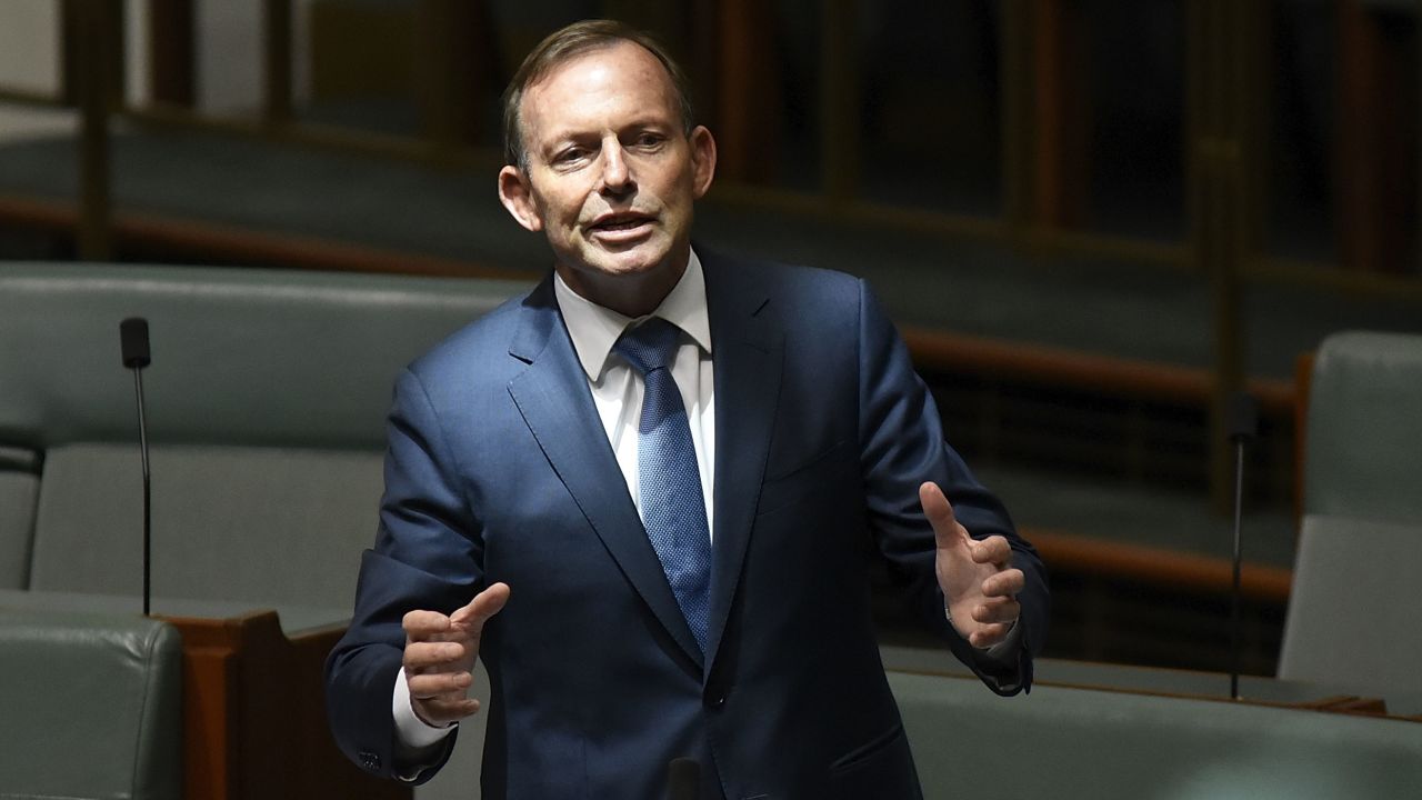 Former Australian Prime Minister Tony Abbott -- considered the face of the campaign to reject same-sex marriage -- discusses amendments to the marriage equality bill at Parliament House on Thursday.