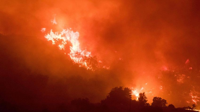 Thomas Fire burns a hillside in Ojai, California, December 7, 2017.
Local emergency officials warned of powerful winds on Thursday that will feed wildfires raging in Los Angeles, threatening multi-million dollar mansions with blazes that have already forced more than 200,000 people to flee. / AFP PHOTO / Kyle GrillotKYLE GRILLOT/AFP/Getty Images