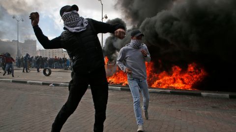 Palestinian demonstrators clash with Israeli security officers during protests in Ramallah on Thursday.