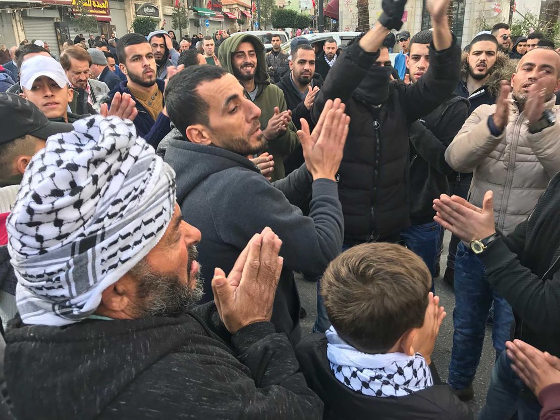 Protesters gather in al-Manara square in Ramallah on Thursday morning.