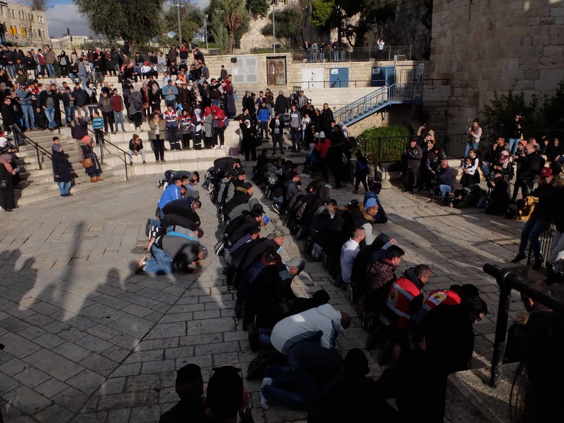 Muslims pray at the Damascus Gate entrance to Jerusalem's Old City on Thursday.