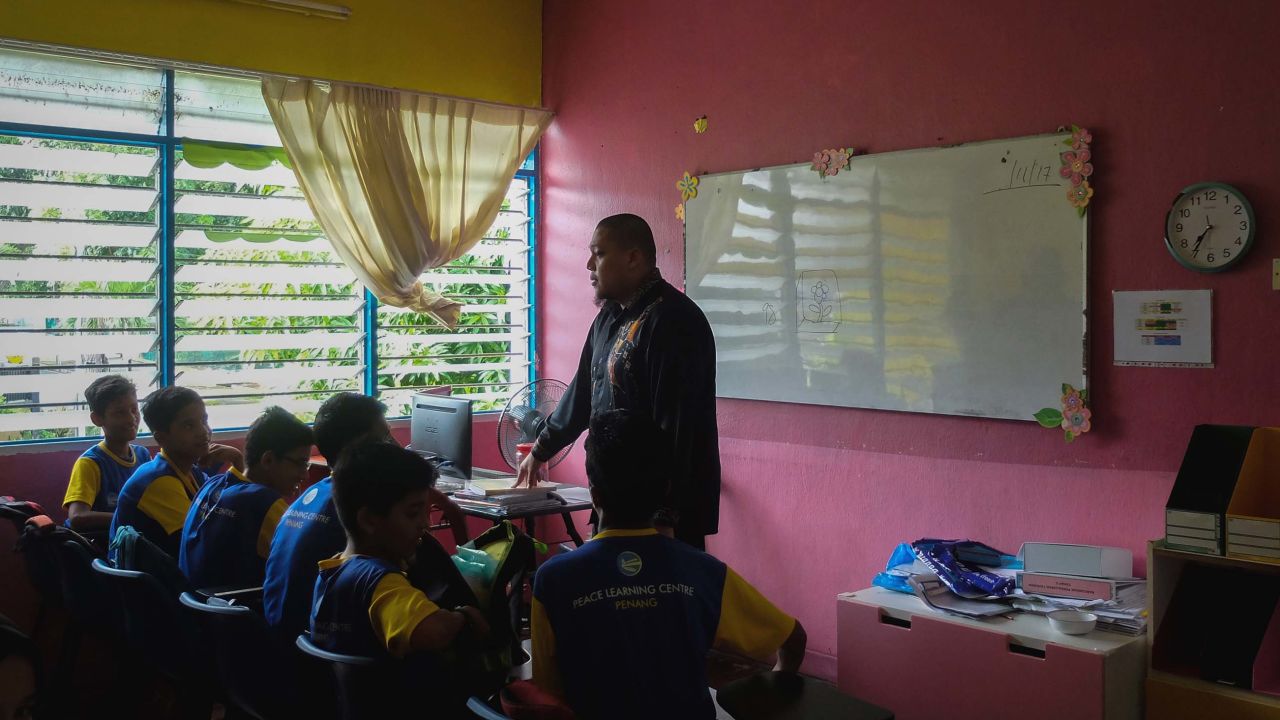 Students sit in class at the Penang Peace Learning Center.
