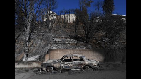 A burnt Mercedes is seen after the Skirball Fire swept through the Los Angeles neighborhood of Bel-Air on Thursday, December 7.