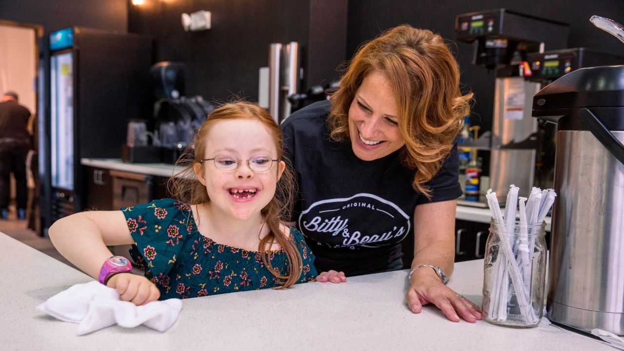 Wright helps her daughter Bitty, 7, wipe down the counter at Bitty & Beau's. "When Beau was born, we were thrust into the world of special needs. So we've been trying to advocate in different ways since then, and that intensified after (we had) Bitty. But it's so hard to get people to change their perceptions. It felt like we were swimming upstream. People are scared of what they don't know, so that's why we've decided to live out loud and to show people what our lives are like." 