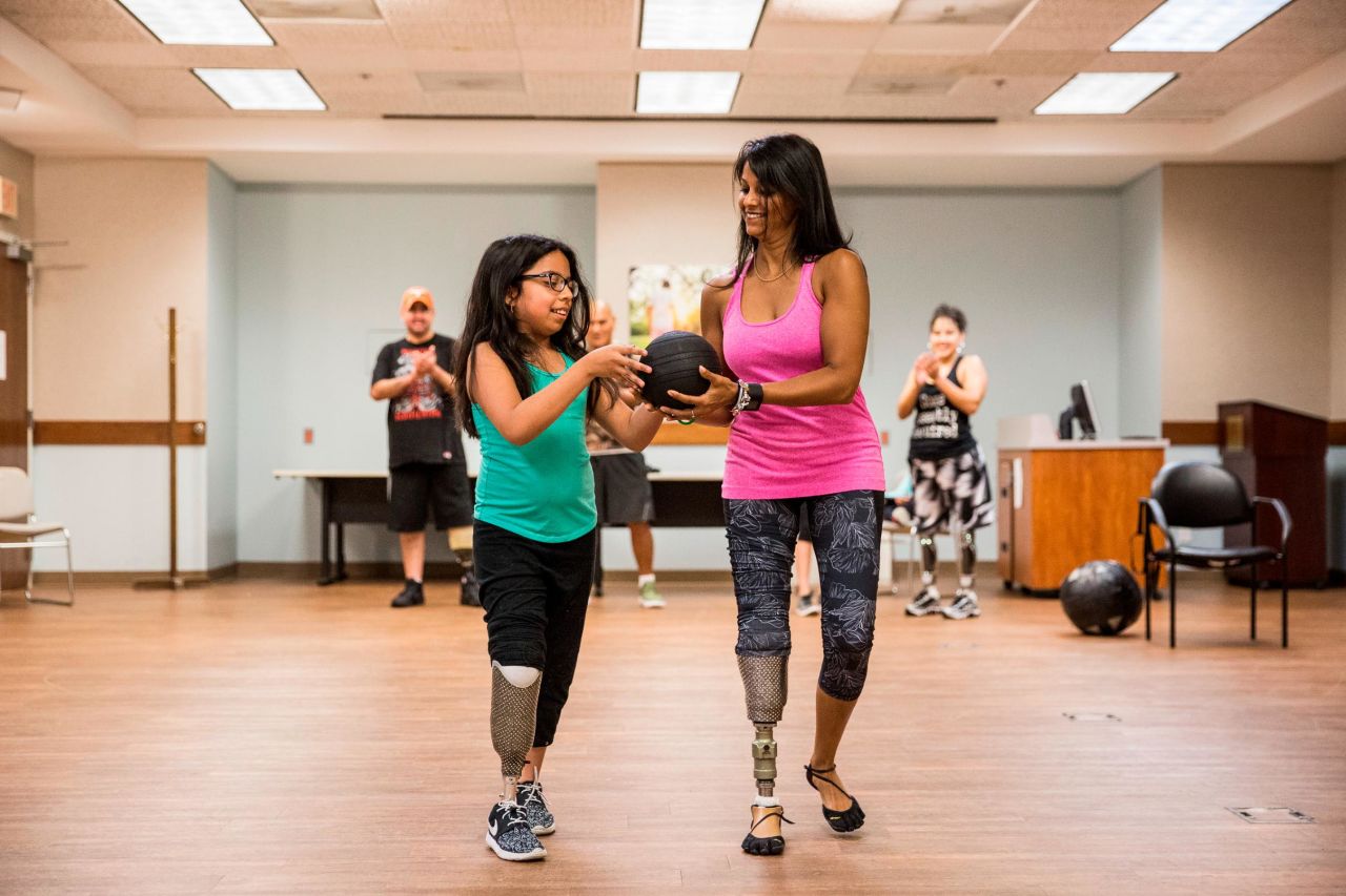 Patel exercises with Bennelina, whose leg was amputated during a battle with cancer that began at age 7. Patel offered support before Bennelina's surgery and went on to explain the many prosthetic options available to amputees. Bennelina decided on a prosthesis similar to Patel's, making them "<a href="http://www.cnn.com/video/data/2.0/video/us/2017/10/05/cnn-heroes-patel-extra.cnn.html">Sparkle Twins</a>." 