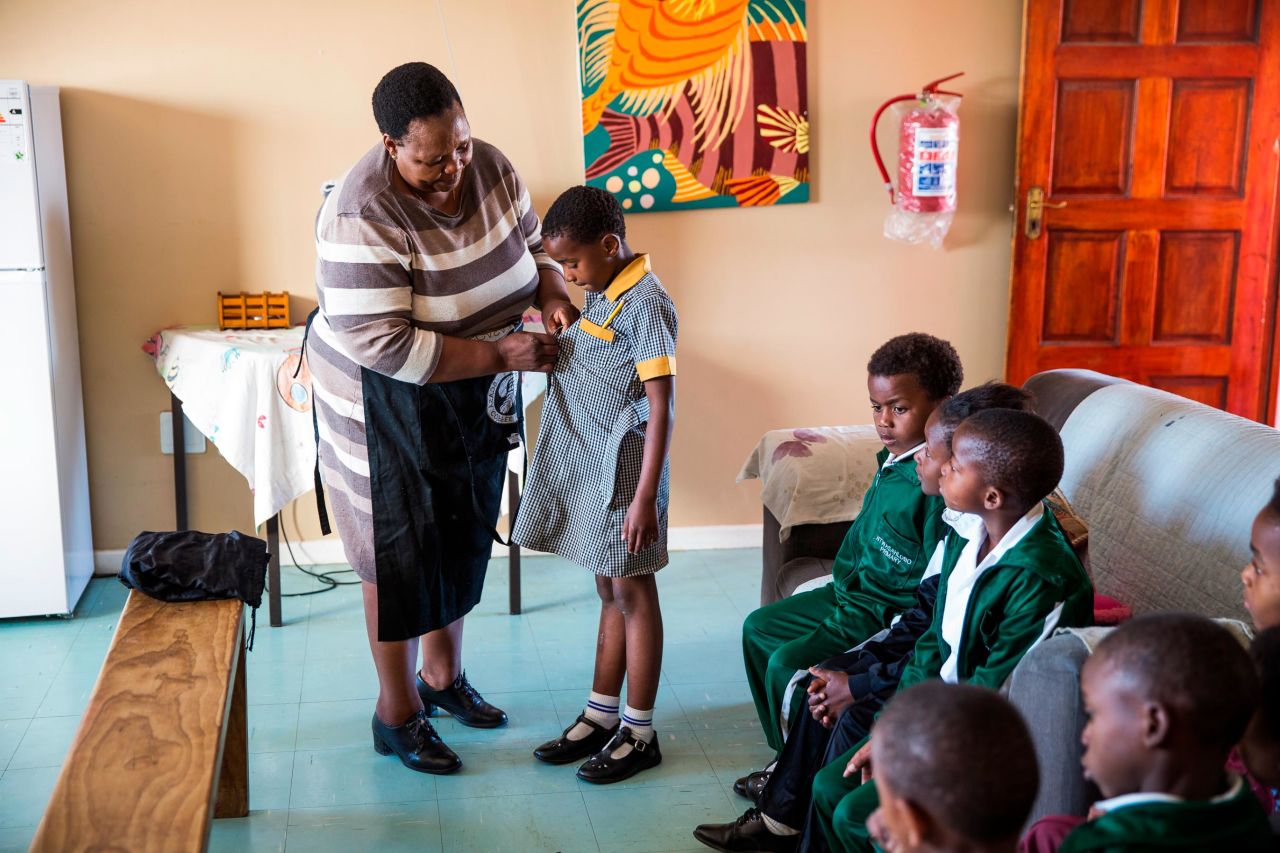 Caring is in "Mama Rosie's" bones. A former schoolteacher, she opened a free day care center in her Cape Town, South Africa, home when she witnessed children playing in a nearby dump. The day care turned into an orphanage after she found a sick child abandoned on her doorstep.