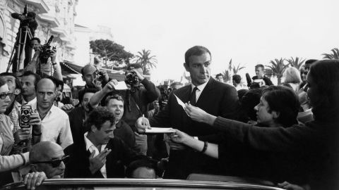 Connery signs autographs at the Cannes Film Festival in France in 1965.
