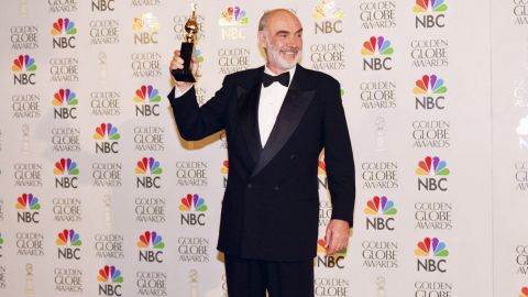 Connery holds up his Cecile B. DeMille Award during the Golden Globe Awards in 1996.