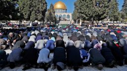 Palestinian Muslim worshippers pray in front of the Dome of the Rock mosque at the al-Aqsa mosque compound in the Jerusalem's Old City on December 8, 2017. 