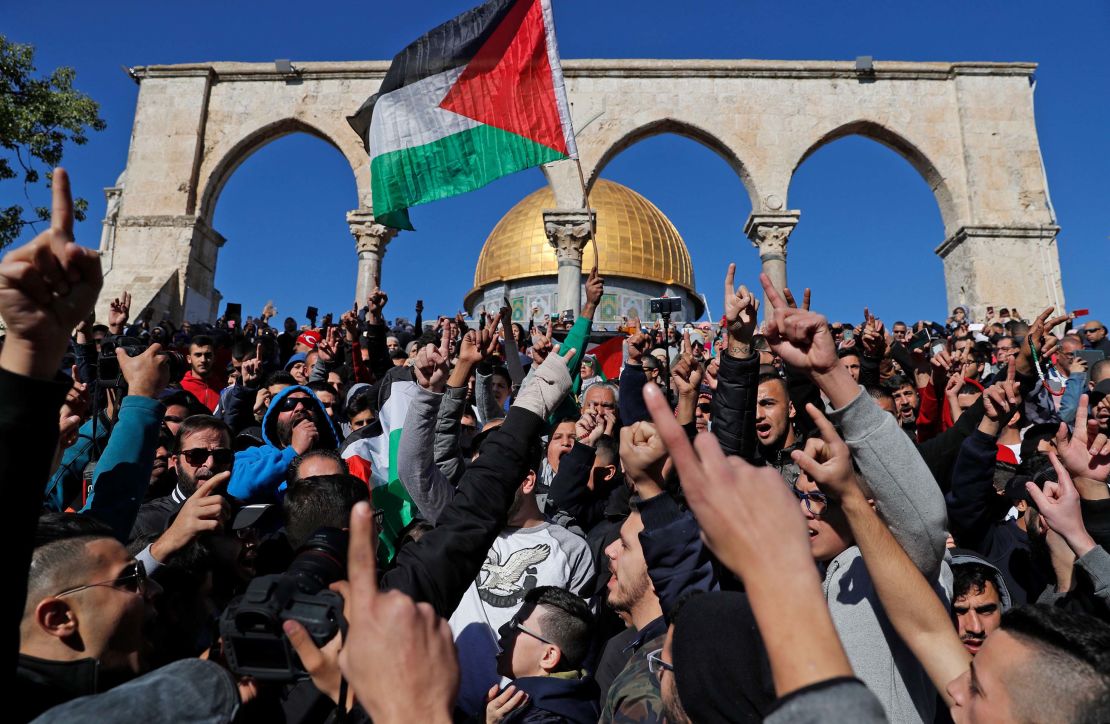 Palestinian Muslim worshippers shout slogans during Friday prayers near the al-Aqsa mosque compound in Jerusalem's Old City.