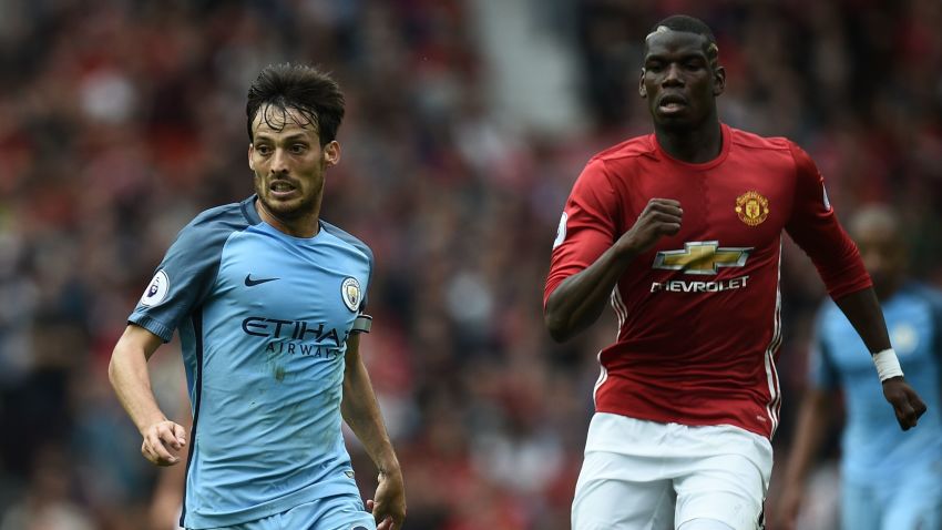 Manchester City's Spanish midfielder David Silva (L) vies with Manchester United's French midfielder Paul Pogba during the English Premier League football match between Manchester United and Manchester City at Old Trafford in Manchester, north west England, on September 10, 2016.
Pep Guardiola savoured a derby success over arch-rival Jose Mourinho on Saturday as Manchester City beat Manchester United 2-1 in an engrossing Premier League clash.
 / AFP / Oli SCARFF / RESTRICTED TO EDITORIAL USE. No use with unauthorized audio, video, data, fixture lists, club/league logos or 'live' services. Online in-match use limited to 75 images, no video emulation. No use in betting, games or single club/league/player publications.  /         (Photo credit should read OLI SCARFF/AFP/Getty Images)