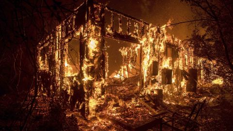 Flames consume a home as a wildfire burns in Ojai, Calif., on Thursday, Dec. 7, 2017. (AP Photo/Noah Berger)