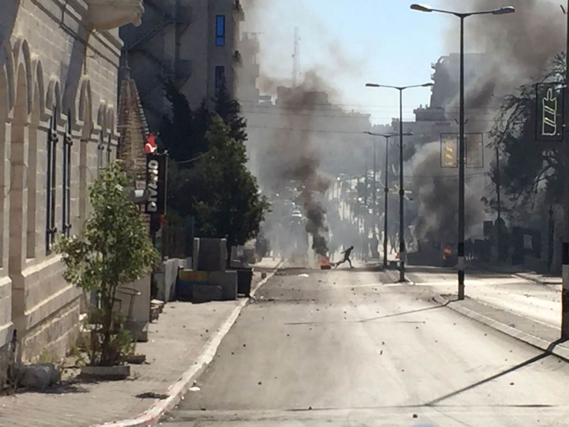 Palestinian protesters and Israeli security forces clash in Bethlehem on Friday.