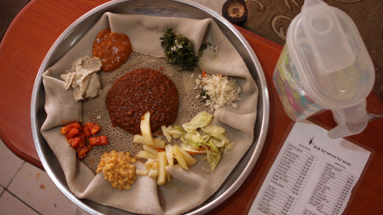 Injera is Ethiopia's national dish -- a grey, spongy bread with vegetables and sauce toppings.