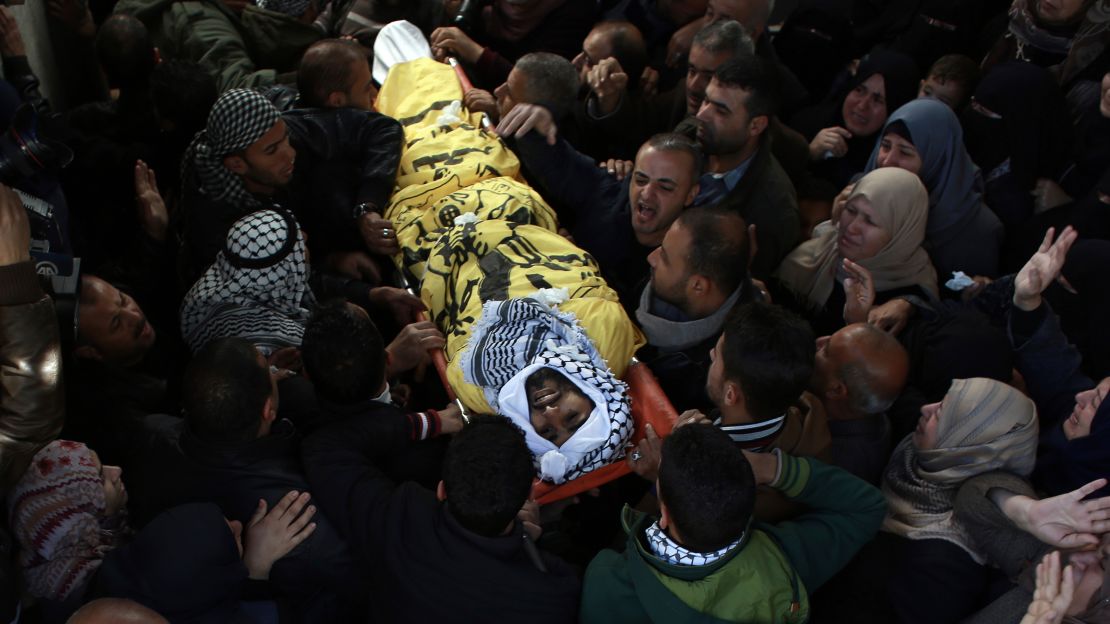 Relatives of Masry mourn during his funeral Saturday in Khan Younis in southern Gaza.