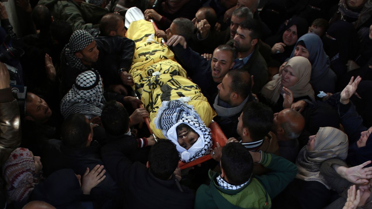 Relatives of Masry mourn during his funeral Saturday in Khan Younis in southern Gaza.