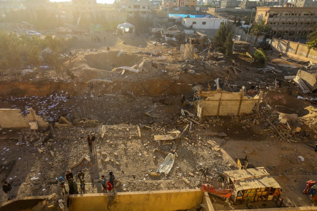 Palestinians look at damage Saturday after an Israeli airstrike in Beit Lahia in northern Gaza.