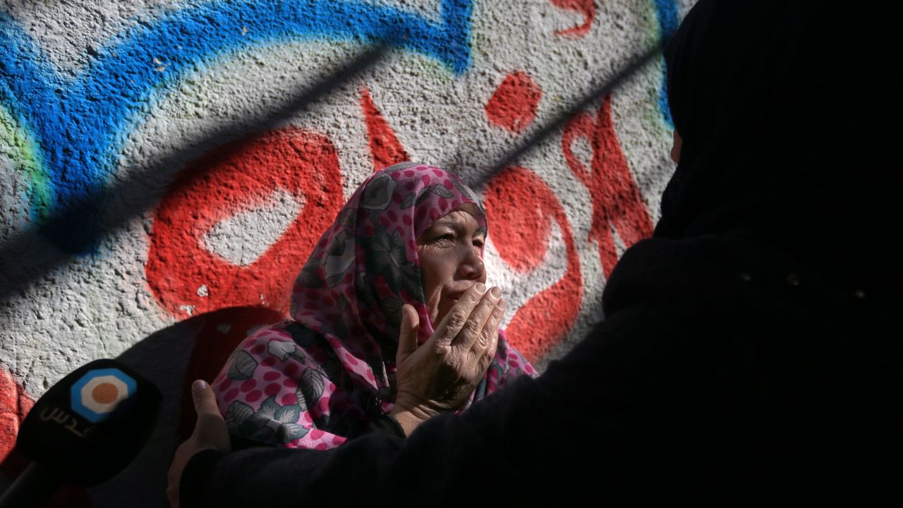 A relative of Mohammad Masry, who died in clashes with Israeli forces, mourns at his funeral.