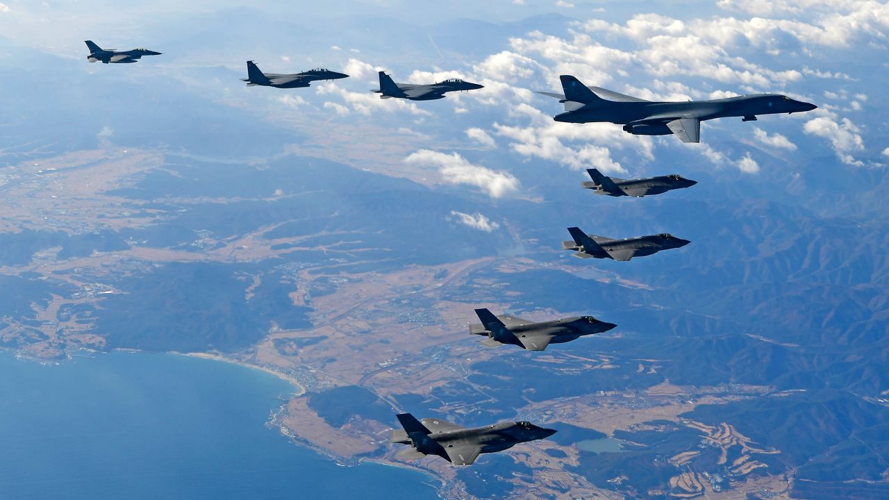 A US Air Force B-1 bomber and South Korean and US fighter jets fly over the Korean Peninsula during the Vigilant air combat exercise (ACE) on December 6, 2017.