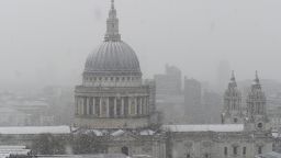 St Paul's Cathedral is seen as snow falls over central London on December 10, 2017. 
Heavy snow fell across northern and central parts of England and Wales and caused disruption, closing roads and grounding flights at Birmingham airport. Up to 10cm is expected to build up quite widely, with 15-20cm in some spots, raising the prospect of roads becoming impassable. / AFP PHOTO / DANIEL SORABJI        (Photo credit should read DANIEL SORABJI/AFP/Getty Images)