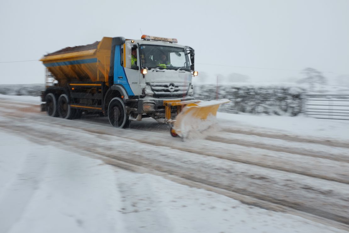 A snow plow clears country lanes in Welsh Frankton, England. 