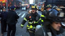 Firefighters arrived on Eighth Avenue near the scene of a reported explosion on Monday morning in Manhattan, New York, December 11, 2017. (David Scull/The New York Times)