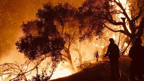 Firefighters battle flames as they advance on homes this week in Carpinteria, California.