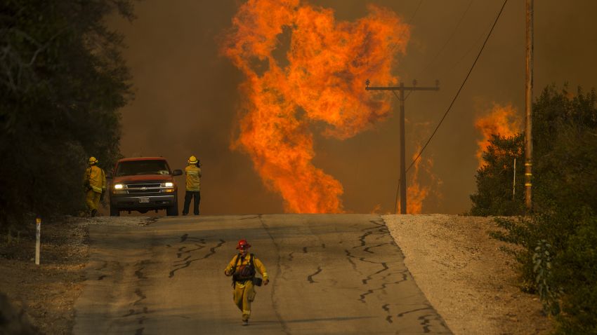 OJAI, CA - DECEMBER 08: Flames rise as a fire front approaches the Lake Casitas area on December 8, 2017 near Ojai, California. Strong Santa Ana winds have been feeding major wildfires all week, destroying hundreds of houses and forcing tens of thousands of people to stay away from their homes.  (Photo by David McNew/Getty Images)