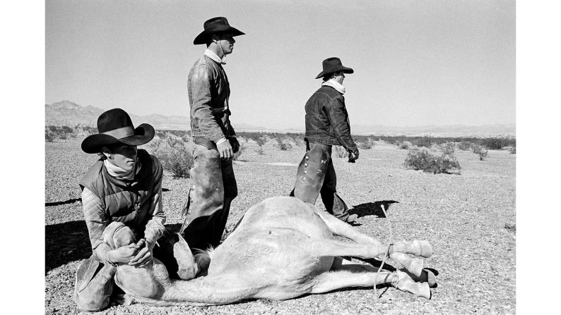 <strong>People and landscapes: </strong>Hurn was drawn to Arizona not because of its dramatic scenery, but because of the effect it had on the people. "It's always people I'm primarily interested in -- and then I'm interested in the landscape to show you where those people live," he says. <em>Pictured here: Bullhead City, the round-up of the last wild horses in the desert of Arizona, 1980.</em>