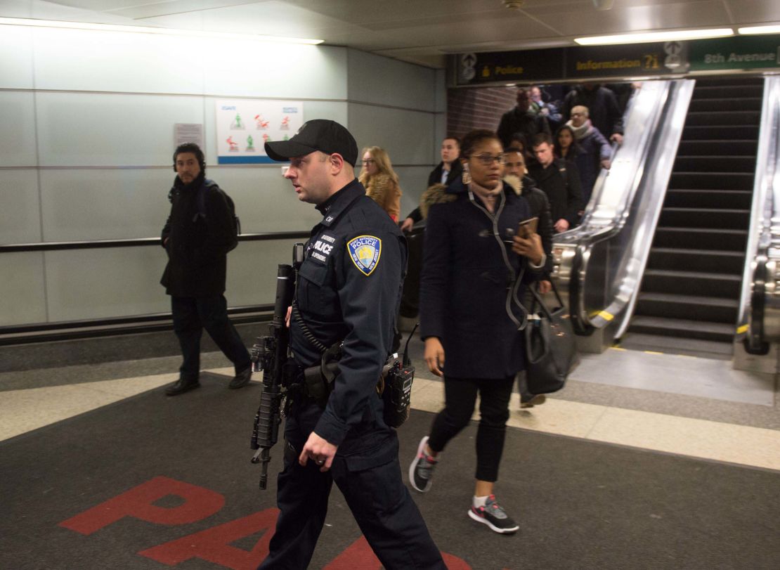 Port Authority police watch as people evacuate after the explosion. 
