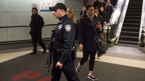 Port Authority police watch as people evacuate after the explosion. 