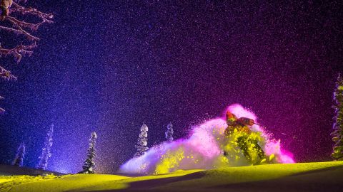 <strong>Pink puff: </strong>"For tighter shots we could shoot from close to the ground and hide the old tracks so we didn't have to move location every time. The skier came straight towards us and the rear light hit the powder cloud from behind to give one color and the side light gave another color. Sometimes the skiers wore light suits containing hundreds of LEDs, which often broke, and the batteries burned holes in their pockets." -- <em>Oskar Enander</em>. (<em>Skier Eric Hjorleifson)</em><br /><br /> 