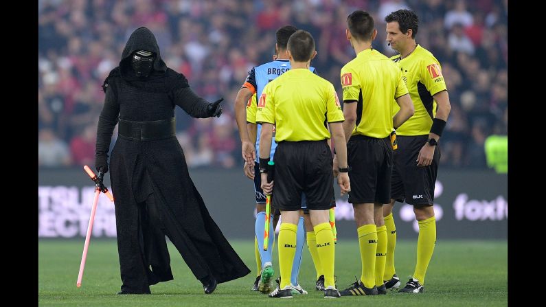 A person dressed as "Star Wars" character Kylo Ren attends the coin toss before an Australian league soccer match in Sydney on Saturday, December 9.