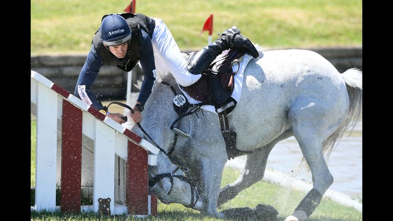 Jock Paget tumbles from Snow Leopard during the cross-country phase of the Puhinui International Horse Trials, a three-day event in Auckland, New Zealand, on Saturday, December 9.