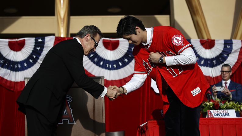 Japanese baseball star Shohei Ohtani, right, shakes hands with Los Angeles Angels owner Arte Moreno during a news conference in Anaheim, California, on Saturday, December 9. Ohtani, a pitcher and outfielder, <a href="index.php?page=&url=http%3A%2F%2Fbleacherreport.com%2Farticles%2F2745772-shohei-ohtani-agrees-to-contract-with-angels-over-mariners-dodgers-and-others" target="_blank" target="_blank">chose to sign with the Angels</a> over several other Major League teams.