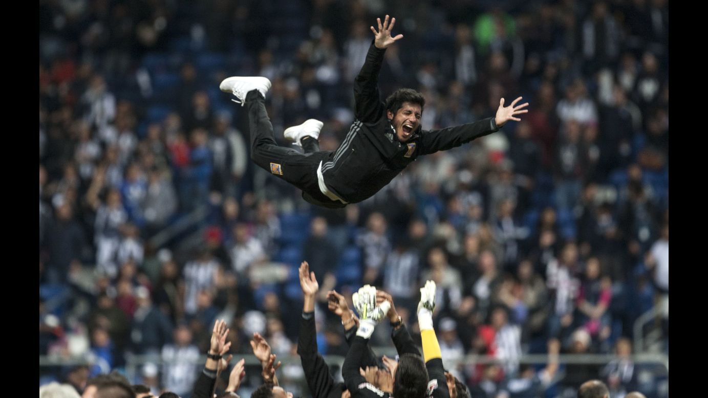 Soccer player Damian Alvarez is thrown into the air by his teammates after Tigres won the Mexican soccer title on Sunday, December 10.